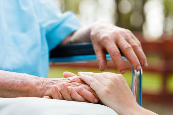 Elderly person hand hold