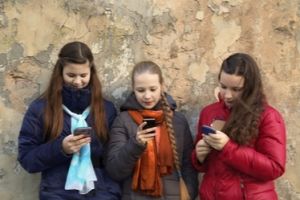 Three girls on phones
