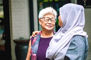 Older woman with younger friend smaller