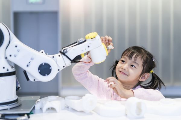 Little girl with robot arm smaller